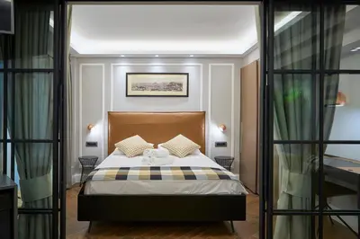 a bedroom with a bed in a room at Marble House in Athens