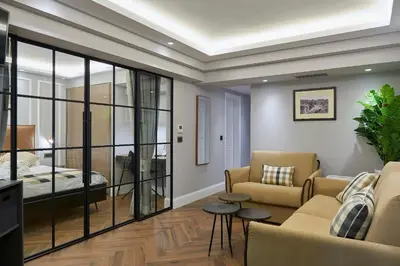 a living room with a couch and a bed at Marble House in Athens