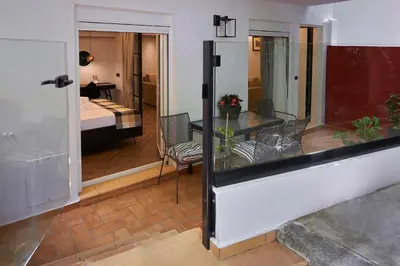 a room with a balcony with a room with a bedroom at Marble House in Athens