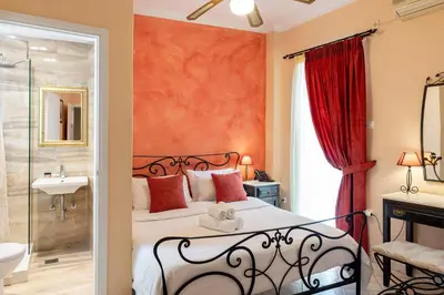 a bedroom with a bed and a shower at Marble House in Athens