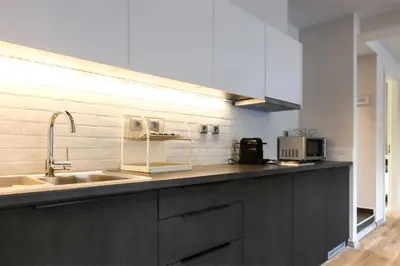 a kitchen with a sink and a counter top at TONI'S 2BD Gem House near Plaka and Syntagma in Athens