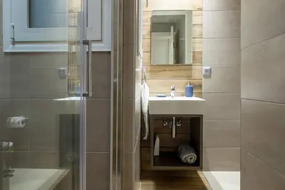 a bathroom with a sink and a shower at TONI'S 2BD Home in Centre, 15 sec to Metro in Athens