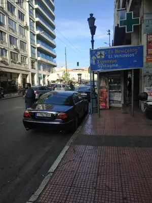 a car parked on the side of a city street at TONI'S 2BD Home in Centre, 15 sec to Metro in Athens