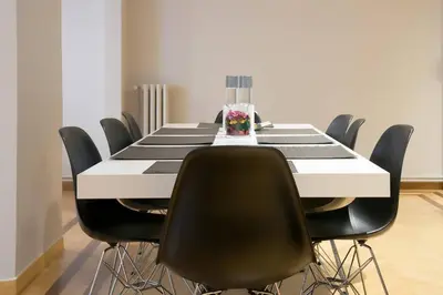 a black and white dining room table with black chairs at TONI'S 4BD near Classy KOLONAKI, locals enjoy it in Athens