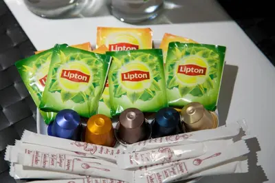 a group of lighters and packets of limecon on a table at TONI'S 4BD near Classy KOLONAKI, locals enjoy it in Athens
