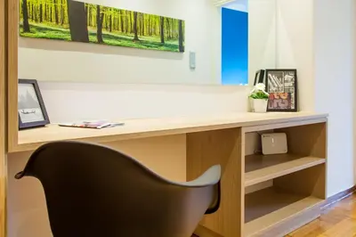 a desk with a black chair in a room at TONI'S Brand-New Studio next to Syntagma Square in Athens