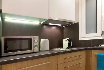 a kitchen with a microwave and a counter top at TONI'S Brand-New Studio next to Syntagma Square in Athens