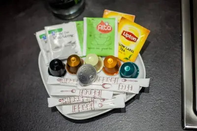 a plate with a bunch of medicines and a pile at TONI'S Brand-New Studio next to Syntagma Square in Athens