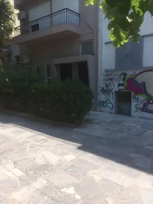 a building with graffiti on the side of it at TONI'S Charming Apartment 2BD, close Thisseo Metro in Athens