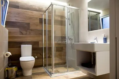 a bathroom with a shower and a toilet and a sink at TONI'S Charming Apartment in the Thisseo station in Athens
