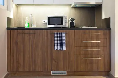 a microwave sitting on top of a kitchen counter at TONI'S Charming Apartment in the Thisseo station in Athens