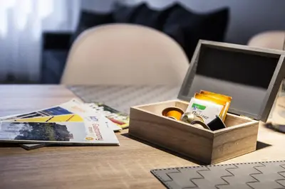 a wooden box on a table with a laptop at TONI'S Cosy Apartment next to Syntagma Square in Athens