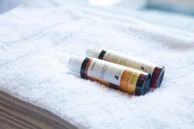 two glue bottles sitting on a white blanket at TONI'S Home for couples or business Travellers 1BD in Athens