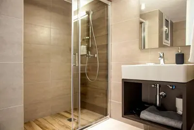 a bathroom with a shower and a sink at TONI'S Spacious Apartment next to Acropolis Museum in Athens
