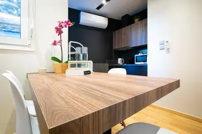 a kitchen with a wooden counter top in a room at TONI'S 2BD Stay in Charming Historical centre in Athens