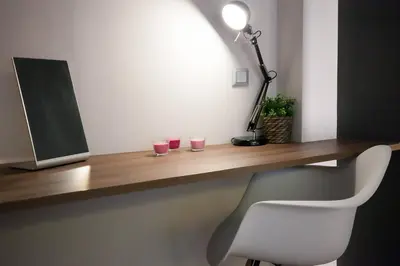 a desk with two glasses and a lamp and a chair at TONI'S 2BD Modern flat in Koukaki near Acropoli in Athens