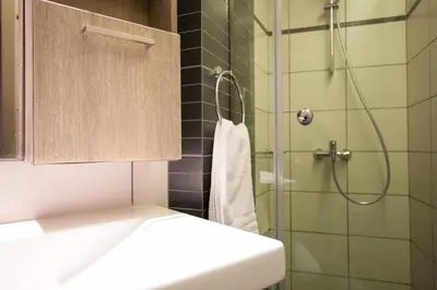 a bathroom with a shower and a toilet and a sink at TONI'S 2BD Modern flat in Koukaki near Acropoli in Athens