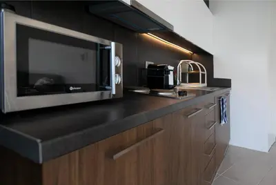 a kitchen with a counter top with a microwave at TONI'S 2BD Home for Superman and Superwoman. in Athens