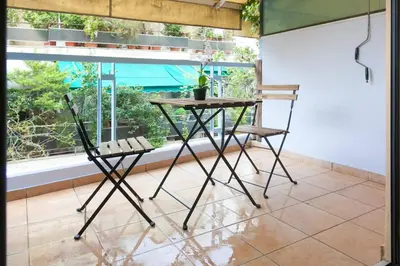 a table and two chairs in front of a window at TONI'S STUDIO for couples near ACROPOLIS Museum in Athens