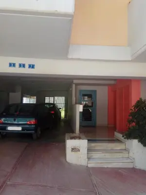 a garage with a car parked in it at TONI'S STUDIO for couples near ACROPOLIS Museum in Athens