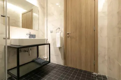 a bathroom with a sink and a mirror at TONI'S makes you an offer, you cannot refuse. in Athens