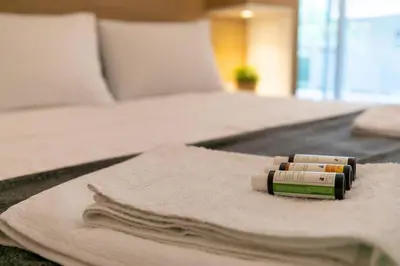 a couple of pill bottles sitting on a bed at TONI'S makes you an offer, you cannot refuse. in Athens