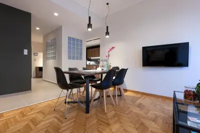 a dining room with a table and chairs at TONI'S 3BD Amazing Home for Wizards and families! in Athens