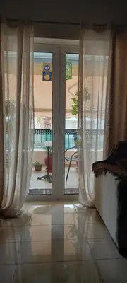 an open door with a view of a patio at Vasi in Markopoulo