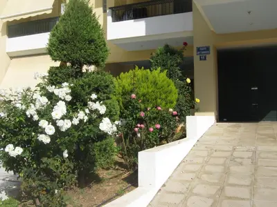 a bunch of flowers in front of a building at Vasi in Markopoulo