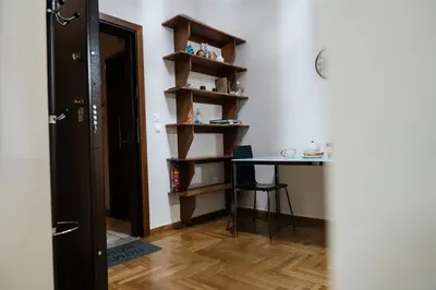 a room with a table and a table and a chair at luxury apartment center athens (wifi) in Athens