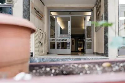 an entrance to a building with white doors at luxury apartment center athens (wifi) in Athens