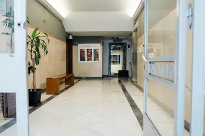 an empty hallway of a building with a door at luxury apartment center athens (wifi) in Athens