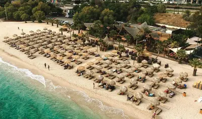 an aerial view of a beach with a group of people at Edem Riviera Studio,close to beach,in Paleo Faliro in Athens