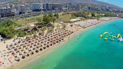 an aerial view of a beach with people and umbrellas at Edem Riviera Studio,close to beach,in Paleo Faliro in Athens