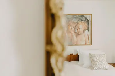 a framed picture of two children on a bed at BEST HOUSE, Attiki Metro, Athens in Athens