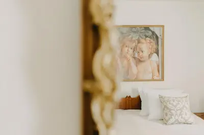 a framed picture of two children on a bed at BEST HOUSE, Attiki Metro, Athens in Athens