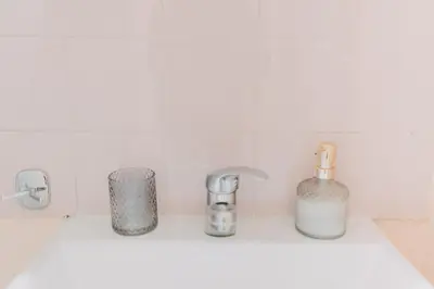 a white kitchen sink with three chrome faucets at BEST HOUSE, Attiki Metro, Athens in Athens