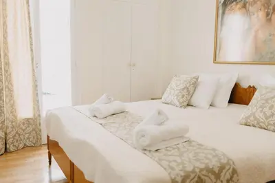 a bedroom with two beds with white towels on them at BEST HOUSE, Attiki Metro, Athens in Athens
