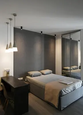 a bedroom with a bed and a table and a mirror at Nest Apartment in Athens