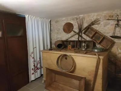 a room with a wooden table with a mirror at Spitaki Spata Airport Studio in Spáta