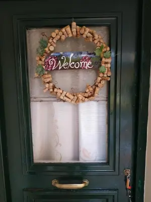 a door with a welcome wreath on it at Spitaki Spata Airport Studio in Spáta