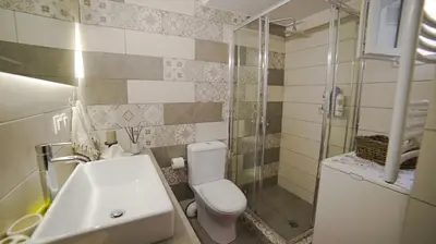 a bathroom with a toilet and a sink and a shower at D16-Cosy downtown apartment in Athens