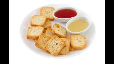 a white plate with bread and two bowls of sauce at Acropolis brand new 1min from metro! in Athens