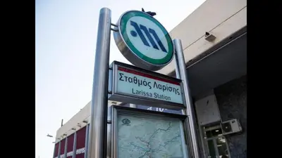 a sign for a bus stop in front of a building at Acropolis brand new 1min from metro! in Athens
