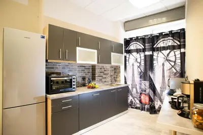 a kitchen with gray cabinets and a microwave at Bedway Athens Hostel in Athens