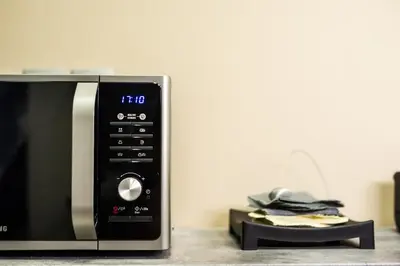 a microwave oven sitting on top of a counter at Bedway Athens Hostel in Athens