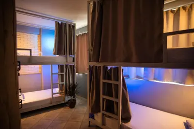 a room with two bunk beds and a ladder at Bedway Athens Hostel in Athens