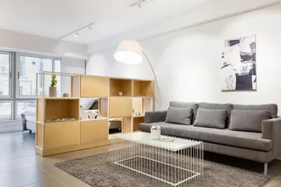 a living room with a couch and a table at Ermou str. Elegant Apartments by UPSTREET in Athens