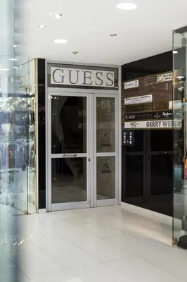 a store front with the glass doors of a store at Ermou str. Elegant Apartments by UPSTREET in Athens
