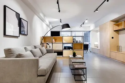 a living room with a couch and a table at Ermou str. Elegant Apartments by UPSTREET in Athens